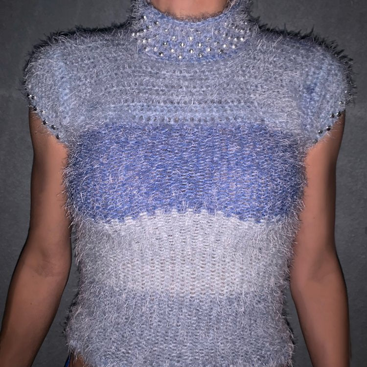 Fuzzy knit short sleeved sweater with pearl beading on the neckline.