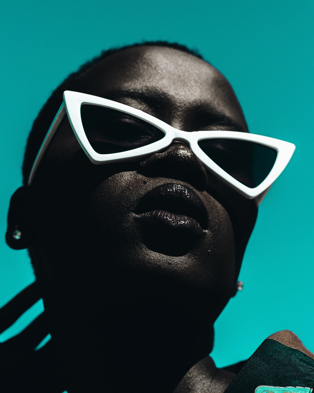 African American model is wearing white cat-eye sunglasses