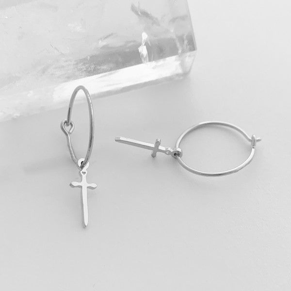 Minimalist, skinny hoops accented with tiny dagger charms