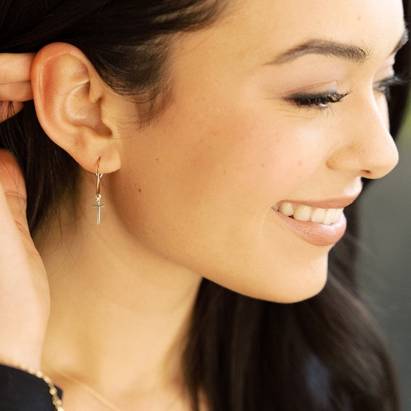 Minimalist, skinny hoops accented with tiny dagger charms