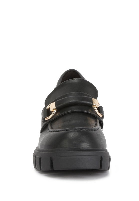 black chunky loafers with gold buckle from Holocene
