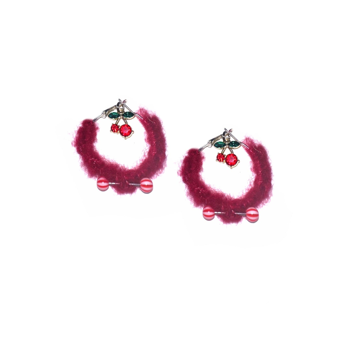 Pink fuzzy hoop earrings with cherry charms and piercings