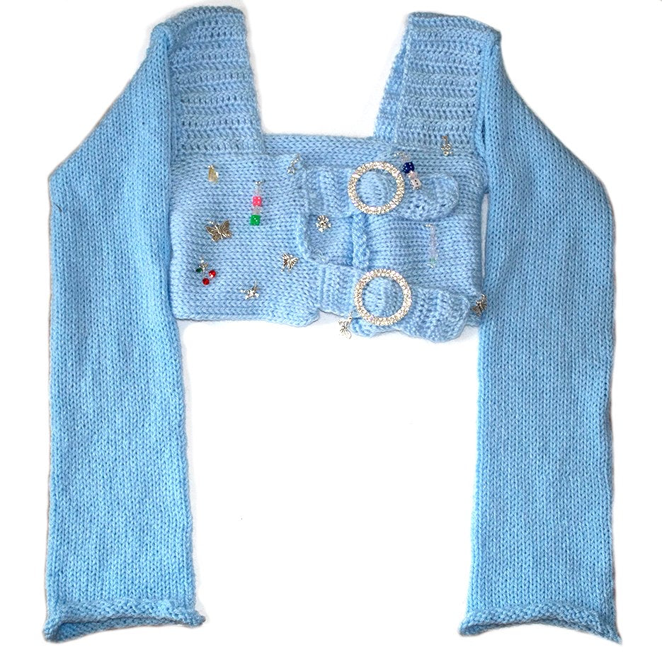 Baby blue crochet square neck top with charm adornments, long sleeves and rhinestone buckle front closure.