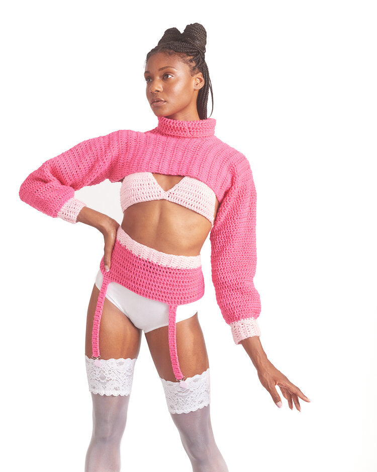 Pink knit cropped sweater and garter set