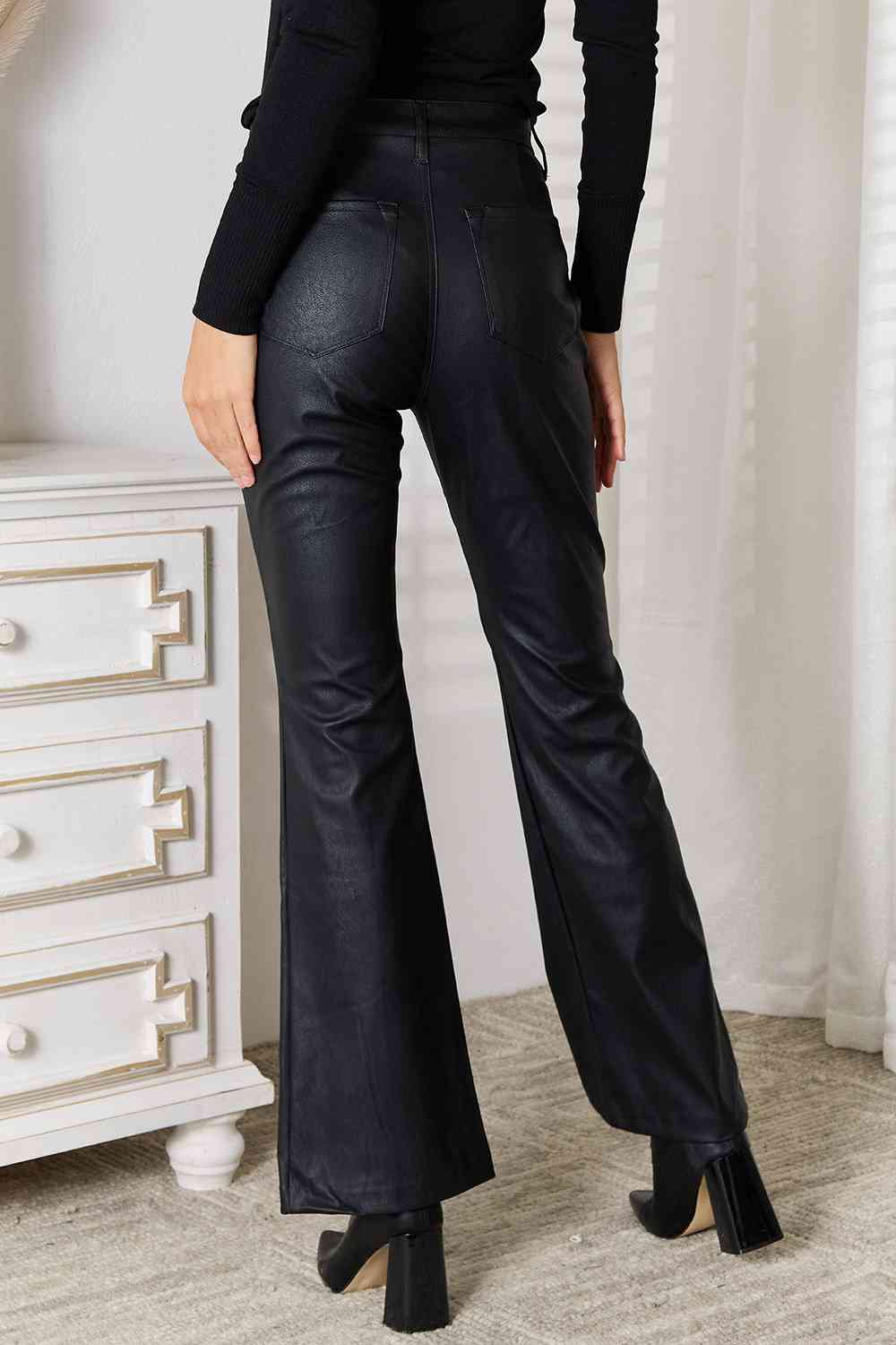 Black leather flare pants with slit for women